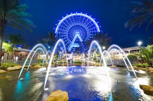 The Coca Cola Orlando Eye Ferris Wheel With Water falls at night Full Size Image